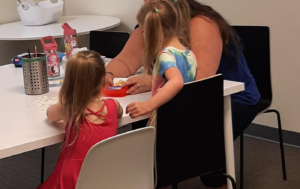 Two families have a buddy tutoring session
